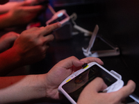 Fairgoers are playing games during the Chinajoy games fair in Shanghai, China, on July 26, 2024. (