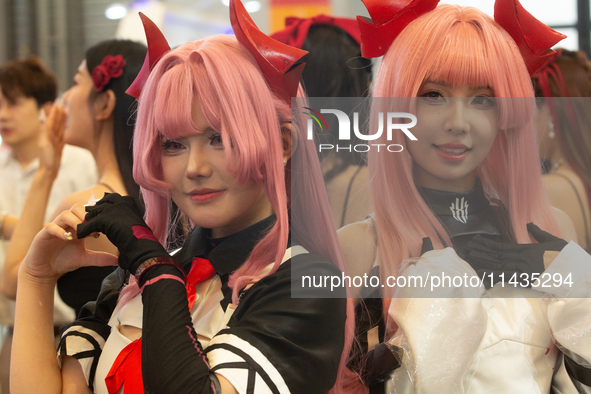 Cosplayers are posing for pictures during the Chinajoy games fair in Shanghai, China, on July 26, 2024. 