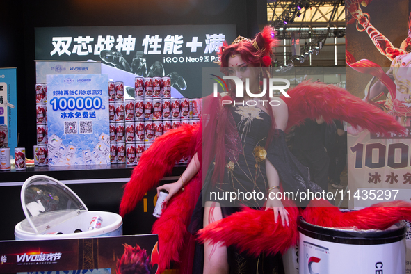 A model is being seen at the IQOO communication technology booth during the Chinajoy games fair in Shanghai, China, on July 26, 2024. 