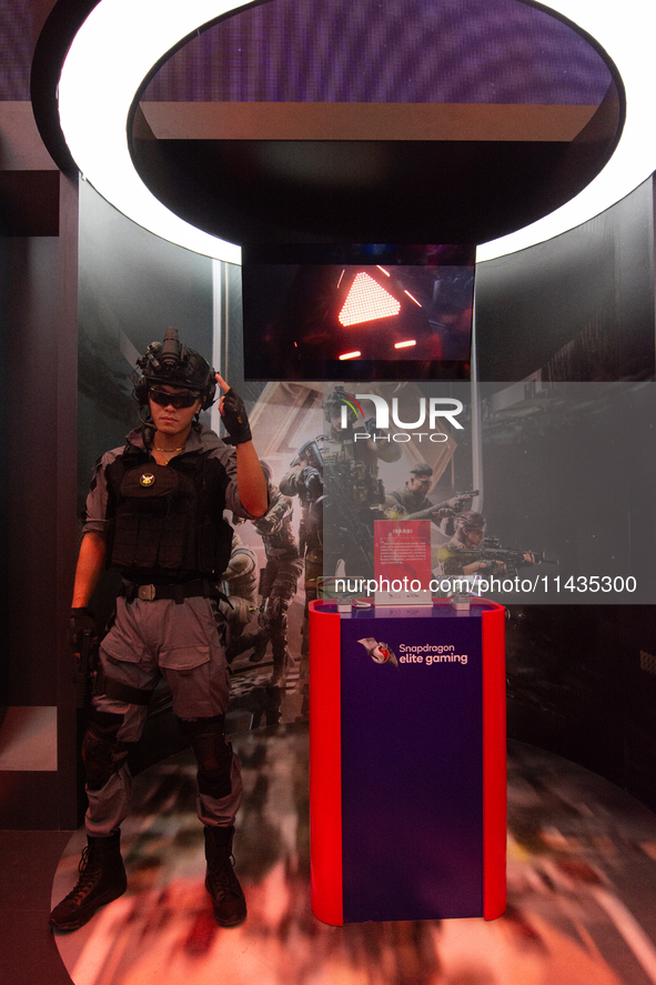 A model is being seen at the Snapdragon elite gaming booth during the Chinajoy games fair in Shanghai, China, on July 26, 2024. 