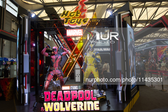 A general view of the Deadpool and Wolverine figures is being displayed at the Marvel studio booth during the Chinajoy games fair in Shangha...