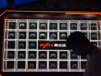 A man is standing in front of PXN games controllers at the PXN booth during the Chinajoy games fair in Shanghai, China, on July 26, 2024. (