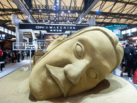 A large sand sculpture is being seen in front of the Awakening Games booth during the Chinajoy Games Fair in Shanghai, China, on July 26, 20...