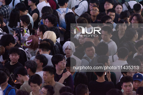 A general view of a crowd of fairgoers is being seen packed at the Chinajoy games fair in Shanghai, China, on July 26, 2024. 