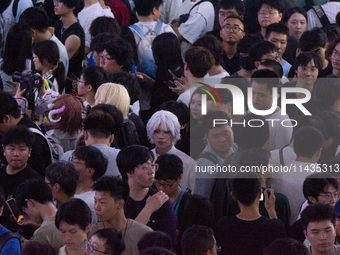 A general view of a crowd of fairgoers is being seen packed at the Chinajoy games fair in Shanghai, China, on July 26, 2024. (