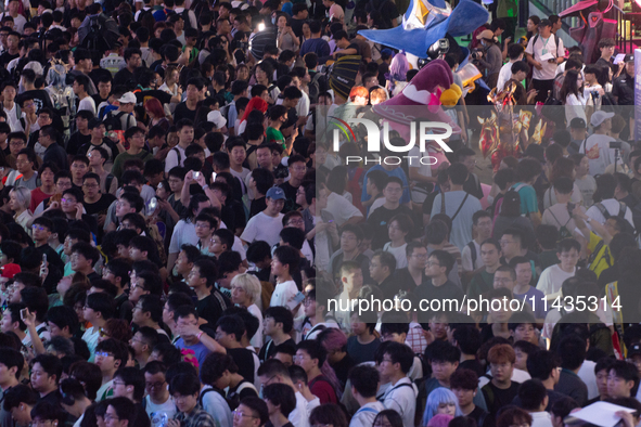 A general view of a crowd of fairgoers is being seen packed at the Chinajoy games fair in Shanghai, China, on July 26, 2024. 