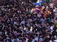 A general view of a crowd of fairgoers is being seen packed at the Chinajoy games fair in Shanghai, China, on July 26, 2024. (