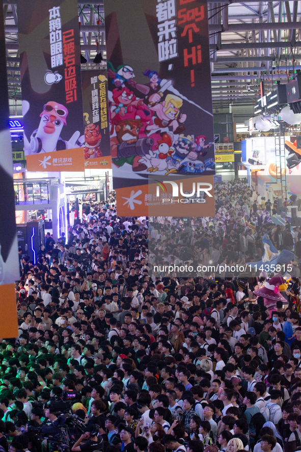 A general view of a crowd of fairgoers is being seen packed at the Chinajoy games fair in Shanghai, China, on July 26, 2024. 