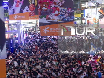 A general view of a crowd of fairgoers is being seen packed at the Chinajoy games fair in Shanghai, China, on July 26, 2024. (