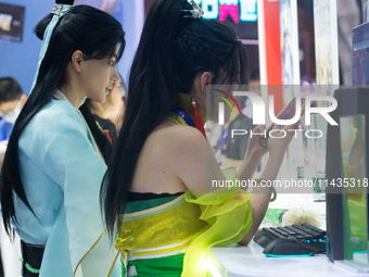 Cosplayers are playing games at the Chinajoy games fair in Shanghai, China, on July 26, 2024. (