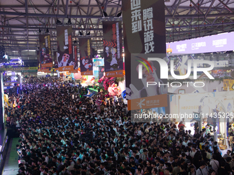 A general view of crowd fairgoers is showing them packed in front of the PlayStation booth during the Chinajoy games fair in Shanghai, China...