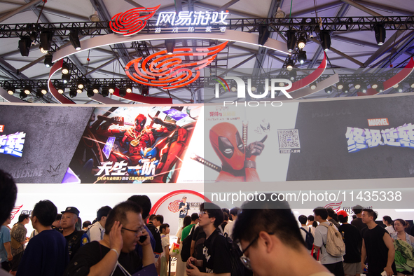 A general view of a crowd of fairgoers is being seen in front of the Netease Games booth at the Chinajoy Games Fair in Shanghai, China, on J...