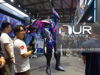 A giant robot is being displayed at the TCL booth at the Chinajoy games fair in Shanghai, China, on July 26, 2024. (