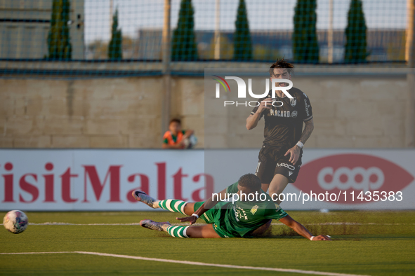 Oualid El Hasni (front) of Floriana is anticipating Joao Silva (back) of Vitoria SC to the ball during the UEFA Europa Conference League, Se...