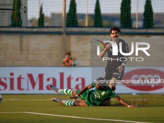 Oualid El Hasni (front) of Floriana is anticipating Joao Silva (back) of Vitoria SC to the ball during the UEFA Europa Conference League, Se...