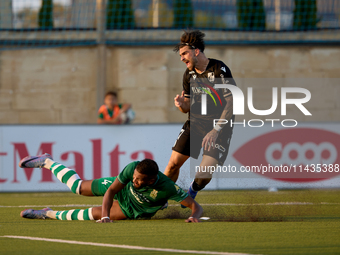 Oualid El Hasni (front) of Floriana is anticipating Joao Silva (back) of Vitoria SC to the ball during the UEFA Europa Conference League, Se...