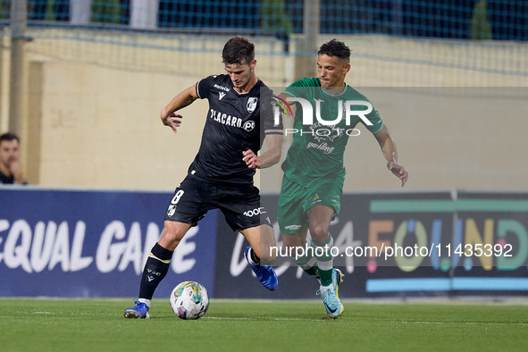 Tomas Handel (L) of Vitoria SC is moving forward with the ball ahead of Matias Garcia (R) of Floriana during the UEFA Europa Conference Leag...