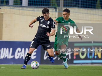 Tomas Handel (L) of Vitoria SC is moving forward with the ball ahead of Matias Garcia (R) of Floriana during the UEFA Europa Conference Leag...