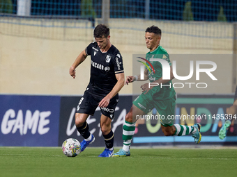 Tomas Handel (L) of Vitoria SC is moving forward with the ball ahead of Matias Garcia (R) of Floriana during the UEFA Europa Conference Leag...