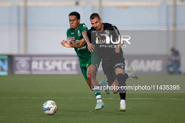 Thiago Santos of Floriana is competing for the ball with Joao Mendes of Vitoria SC during the UEFA Europa Conference League, Second Qualifyi...