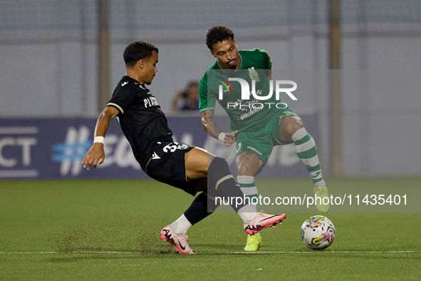 Fernandinho (right) of Floriana is being closely followed by Kaio Cesar (left) of Vitoria SC during the UEFA Europa Conference League, Secon...