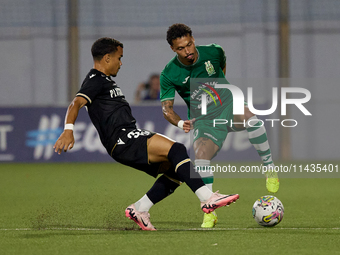 Fernandinho (right) of Floriana is being closely followed by Kaio Cesar (left) of Vitoria SC during the UEFA Europa Conference League, Secon...