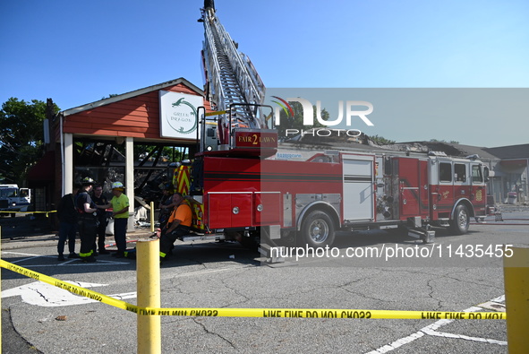 A two-alarm fire is severely damaging Zadies Kosher Bake Shop and a strip mall early Friday morning in Fair Lawn, New Jersey, United States,...