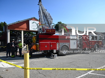 A two-alarm fire is severely damaging Zadies Kosher Bake Shop and a strip mall early Friday morning in Fair Lawn, New Jersey, United States,...