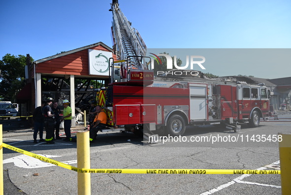 A two-alarm fire is severely damaging Zadies Kosher Bake Shop and a strip mall early Friday morning in Fair Lawn, New Jersey, United States,...