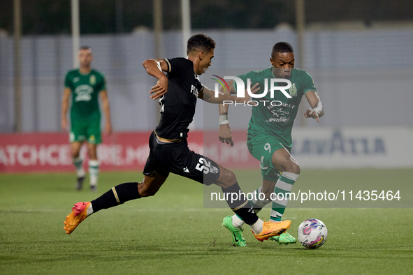 Kemar Reid (R) of Floriana is being closely followed by Baio Alberto (L) of Vitoria SC during the UEFA Europa Conference League, Second Qual...