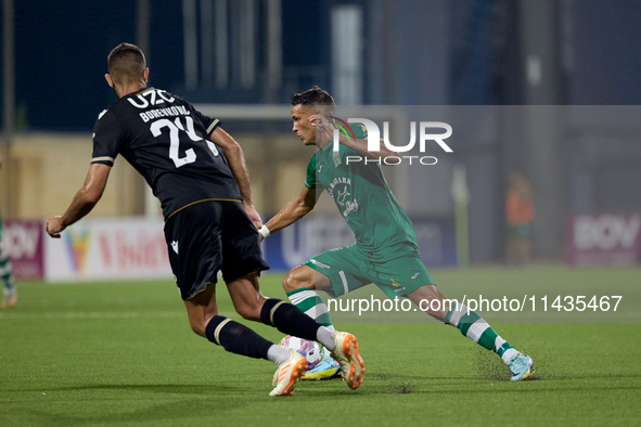 Matias Garcia of Floriana is confronting Toni Borevkovic of Vitoria SC during the UEFA Europa Conference League, Second Qualifying Round, 1s...