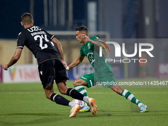 Matias Garcia of Floriana is confronting Toni Borevkovic of Vitoria SC during the UEFA Europa Conference League, Second Qualifying Round, 1s...