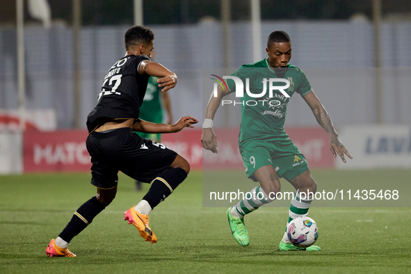 Kemar Reid (R) of Floriana is being closely followed by Baio Alberto (L) of Vitoria SC during the UEFA Europa Conference League, Second Qual...