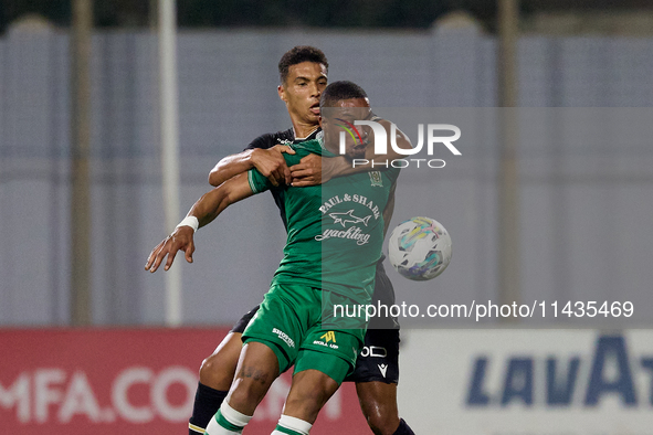 Kemar Reid (front) of Floriana is being closely challenged by Baio Alberto (back) of Vitoria SC during the UEFA Europa Conference League, Se...