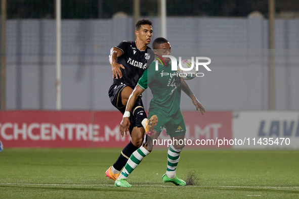 Kemar Reid (front) of Floriana is being closely challenged by Baio Alberto (back) of Vitoria SC during the UEFA Europa Conference League, Se...