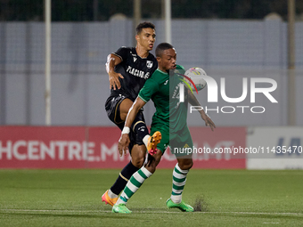 Kemar Reid (front) of Floriana is being closely challenged by Baio Alberto (back) of Vitoria SC during the UEFA Europa Conference League, Se...