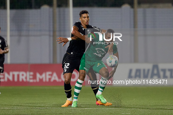 Kemar Reid (front) of Floriana is being closely challenged by Baio Alberto (back) of Vitoria SC during the UEFA Europa Conference League, Se...