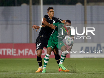 Kemar Reid (front) of Floriana is being closely challenged by Baio Alberto (back) of Vitoria SC during the UEFA Europa Conference League, Se...