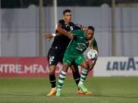 Kemar Reid (front) of Floriana is being closely challenged by Baio Alberto (back) of Vitoria SC during the UEFA Europa Conference League, Se...