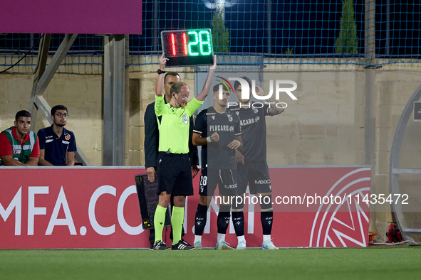 Jose Carlos (2nd L) and Marco Cruz (R) of Vitoria SC are preparing to enter the pitch as substitutes during the UEFA Europa Conference Leagu...