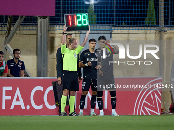 Jose Carlos (2nd L) and Marco Cruz (R) of Vitoria SC are preparing to enter the pitch as substitutes during the UEFA Europa Conference Leagu...