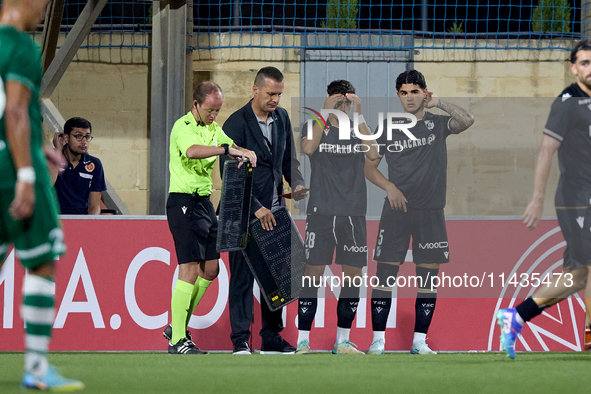 Jose Carlos (2nd L) and Marco Cruz (R) of Vitoria SC are preparing to enter the pitch as substitutes during the UEFA Europa Conference Leagu...