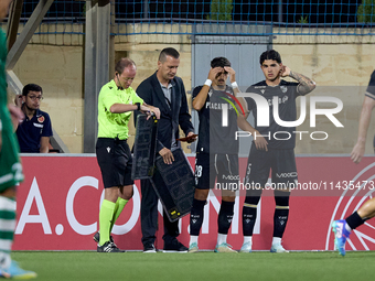 Jose Carlos (2nd L) and Marco Cruz (R) of Vitoria SC are preparing to enter the pitch as substitutes during the UEFA Europa Conference Leagu...