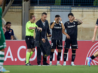 Jose Carlos (2nd L) and Marco Cruz (R) of Vitoria SC are preparing to enter the pitch as substitutes during the UEFA Europa Conference Leagu...