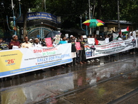 Indians for Palestine group members are holding posters during a protest, amid the ongoing conflict in Gaza between Israel and Hamas, in Kol...