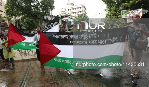 Indians for Palestine group members are holding flags of Palestine during a protest, amid the ongoing conflict in Gaza between Israel and Ha...