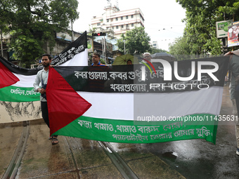 Indians for Palestine group members are holding flags of Palestine during a protest, amid the ongoing conflict in Gaza between Israel and Ha...