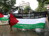 Indians for Palestine group members are holding flags of Palestine during a protest, amid the ongoing conflict in Gaza between Israel and Ha...