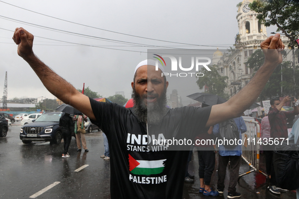 Indian supporters for Palestine are holding posters and the Palestine National Flag during a protest rally, amid the ongoing conflict in Gaz...