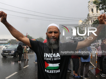 Indian supporters for Palestine are holding posters and the Palestine National Flag during a protest rally, amid the ongoing conflict in Gaz...